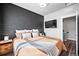 Well-lit bedroom with a large bed and built-in TV at 1025 S Gilbert St # C, Castle Rock, CO 80104