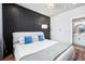 Spacious bedroom with a dark accent wall and en-suite bathroom at 1025 S Gilbert St # C, Castle Rock, CO 80104