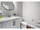 Modern bathroom with white vanity, tile shower, and stylish mirror at 1025 S Gilbert St # C, Castle Rock, CO 80104