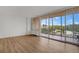 Living room with hardwood floors and access to balcony at 3100 E Cherry Creek S Dr # 307, Denver, CO 80209