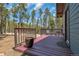 Spacious deck with wooded views and seating area at 28 Deer Rd, Evergreen, CO 80439
