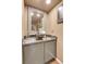Chic powder room with vessel sink and decorative mirror at 1736 S Pagosa Way, Aurora, CO 80017