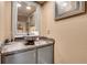 Chic powder room with vessel sink and decorative mirror at 1736 S Pagosa Way, Aurora, CO 80017