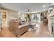 Living room showcasing comfortable furniture and a view into the bathroom at 1736 S Pagosa Way, Aurora, CO 80017