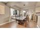 Elegant dining room with a large table and hardwood floors at 1736 S Pagosa Way, Aurora, CO 80017