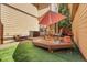 Private patio with seating area and umbrella at 1736 S Pagosa Way, Aurora, CO 80017