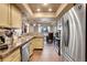 Modern kitchen with stainless steel appliances and granite countertops at 1736 S Pagosa Way, Aurora, CO 80017