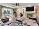 Living room featuring a fireplace, comfortable seating and a large TV at 1736 S Pagosa Way, Aurora, CO 80017