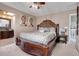 Main bedroom with a king-size bed and ensuite bathroom access at 1736 S Pagosa Way, Aurora, CO 80017