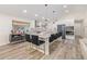 Open concept kitchen featuring a large island, granite countertops, and stylish lighting at 3660 Betty St, Castle Rock, CO 80108