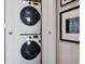 Stackable washer and dryer in a closet at 2466 S Delaware St # 2, Denver, CO 80223