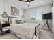 Bright bedroom with a comfortable bed, stylish decor, and a ceiling fan at 2466 S Delaware St # 2, Denver, CO 80223