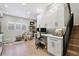 Home office with built-in desk and hardwood floors at 2466 S Delaware St # 2, Denver, CO 80223