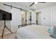 Bedroom with ensuite bathroom and barn door entry at 2466 S Delaware St # 2, Denver, CO 80223