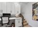 Home office space with white built-in cabinets and a workspace at 2466 S Delaware St # 2, Denver, CO 80223