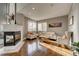 Bright living room features a fireplace and hardwood floors at 22580 E Ridge Trail Dr, Aurora, CO 80016