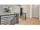 Upstairs hallway overlooking the living room and entryway at 24113 E 36Th Pl, Aurora, CO 80019