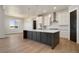 Open concept kitchen with large island and stainless steel appliances at 24113 E 36Th Pl, Aurora, CO 80019