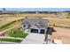 Aerial view of a house with a large yard at 24113 E 36Th Pl, Aurora, CO 80019
