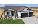 Two-story house with a two-car garage and landscaping at 24113 E 36Th Pl, Aurora, CO 80019
