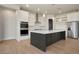 Modern kitchen with white cabinets, quartz countertops, and stainless steel appliances at 24113 E 36Th Pl, Aurora, CO 80019
