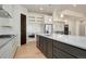 Open concept kitchen with modern island and white cabinetry at 24113 E 36Th Pl, Aurora, CO 80019