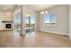 Bright dining room with hardwood floors and sliding doors to a deck at 24113 E 36Th Pl, Aurora, CO 80019