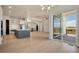 Open concept kitchen with island, stainless steel appliances, and access to deck at 24113 E 36Th Pl, Aurora, CO 80019