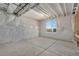 Unfinished basement with concrete floor and window at 24113 E 36Th Pl, Aurora, CO 80019
