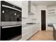 Modern kitchen with double ovens and stainless steel appliances at 24113 E 36Th Pl, Aurora, CO 80019