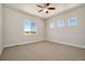 Bright bedroom with neutral carpeting and large window offering scenic views at 24113 E 36Th Pl, Aurora, CO 80019