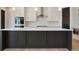 Stylish kitchen island with dark cabinetry and white countertops at 24113 E 36Th Pl, Aurora, CO 80019