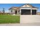 Modern farmhouse exterior with two-car garage and manicured lawn at 24113 E 36Th Pl, Aurora, CO 80019