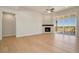 Living room with corner fireplace and sliding glass doors to a deck at 24113 E 36Th Pl, Aurora, CO 80019