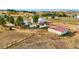 Aerial view showcasing multiple outbuildings on a large property at 2127 Helen Ct, Parker, CO 80138