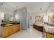 Main bathroom with dual sinks, glass shower, and jetted tub at 1077 Carriage Hills Dr, Boulder, CO 80302