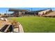 Artificial turf lawn with a pergola and seating at 3893 Freestone Pt, Castle Rock, CO 80108
