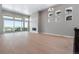 Bright living room with hardwood floors, fireplace, and deck access at 3893 Freestone Pt, Castle Rock, CO 80108