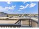 Deck overlooking neighborhood with distant mountain views at 3893 Freestone Pt, Castle Rock, CO 80108