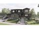 Two-story home with stone and dark siding, a three-car garage, and landscaped yard at 15363 Irving Ct, Broomfield, CO 80023