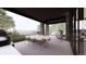 Covered patio with outdoor dining and seating area overlooking scenic views at 15363 Irving Ct, Broomfield, CO 80023
