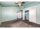 Bright bedroom with vaulted ceiling, ceiling fan and carpet flooring at 3233 S Zeno Ct # C, Aurora, CO 80013