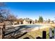 Community pool with pool cover and surrounding yard at 3233 S Zeno Ct # C, Aurora, CO 80013