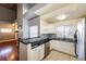 Well-equipped kitchen with granite countertops and white cabinets at 3233 S Zeno Ct # C, Aurora, CO 80013