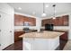 Modern kitchen featuring granite countertops, stainless steel appliances, and a center island at 7844 S Elk St, Aurora, CO 80016