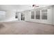 Spacious living area with sliding glass doors and ample natural light at 7844 S Elk St, Aurora, CO 80016