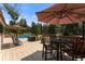 Relaxing deck with a pool and patio furniture at 36725 Forest Trl, Elizabeth, CO 80107