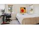 Bedroom with a bed, desk, chair, and windows at 5519 Ponderosa Dr, Parker, CO 80134
