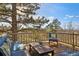 Outdoor deck with seating, a table, and scenic views at 5519 Ponderosa Dr, Parker, CO 80134