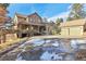Inviting home with stone and stucco exterior, large driveway, and covered front porch at 5519 Ponderosa Dr, Parker, CO 80134